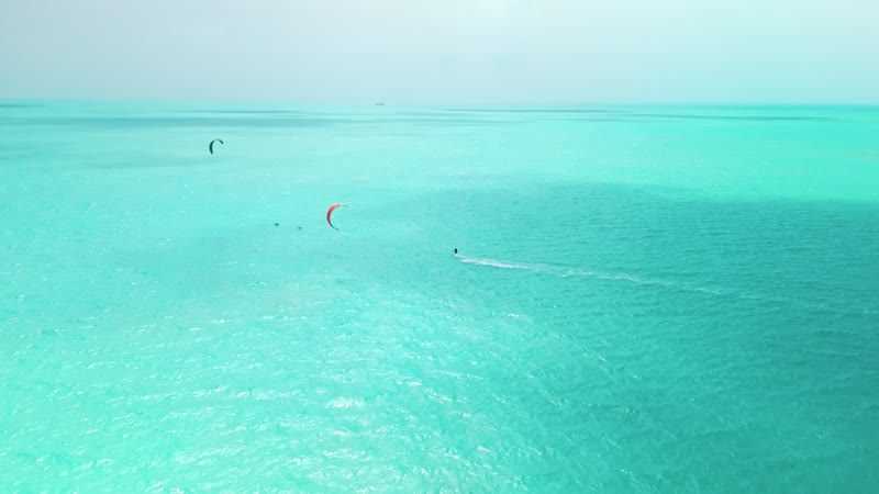Drone shot of kitesurfers in Long Bay