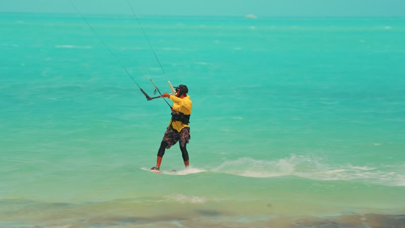 Handheld shot of kitesurfers in Long Bay