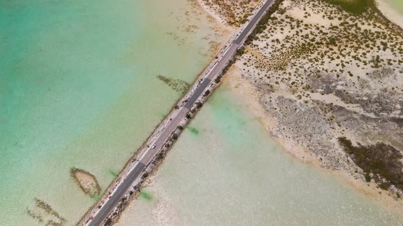 Drone shot following car cross Middle Caicos causeway