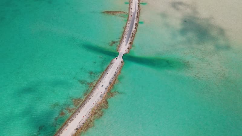 Drone shot following car cross Middle Caicos causeway