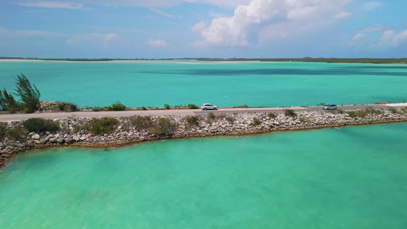 Drone shot following car cross Middle Caicos causeway
