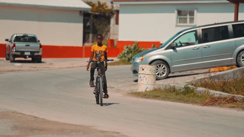 Slow-motion shot of local biking in South Caicos
