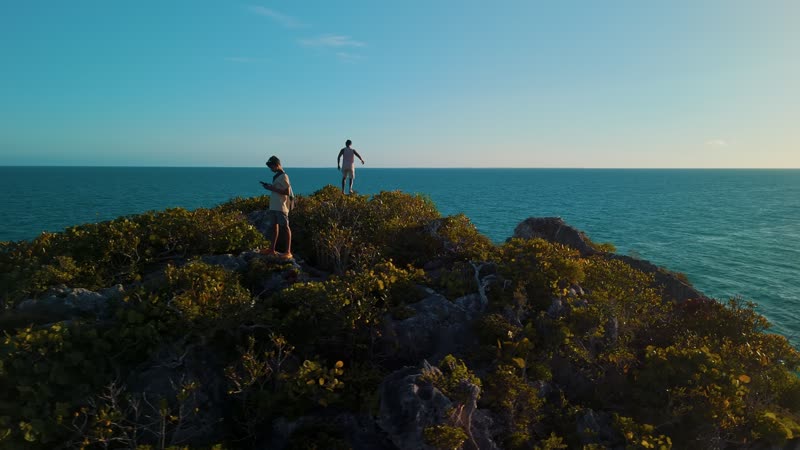 Sunset drone view of tourists looking out over Splitrock