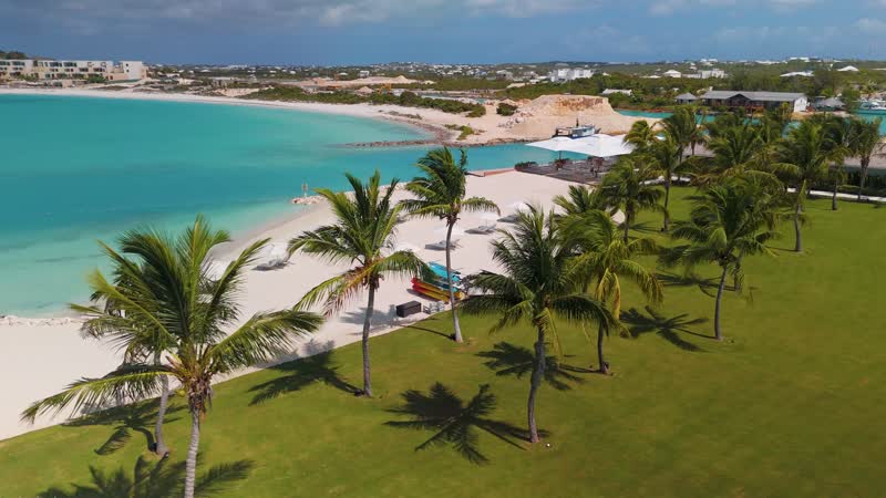 Slow moving drone shot of beach area in Wymara Villas