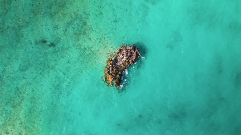 Revolving shot of rock formations off of Turtle Tail shores